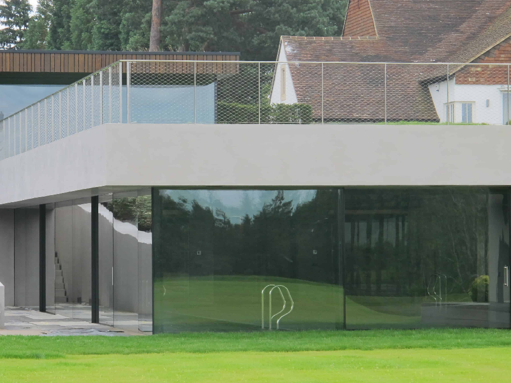 Infiniti Frameless Sliding Doors - Glassspace | Structural Glass Rooms